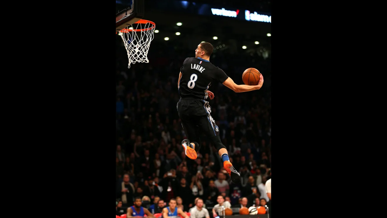 Basketball player making a slam dunk